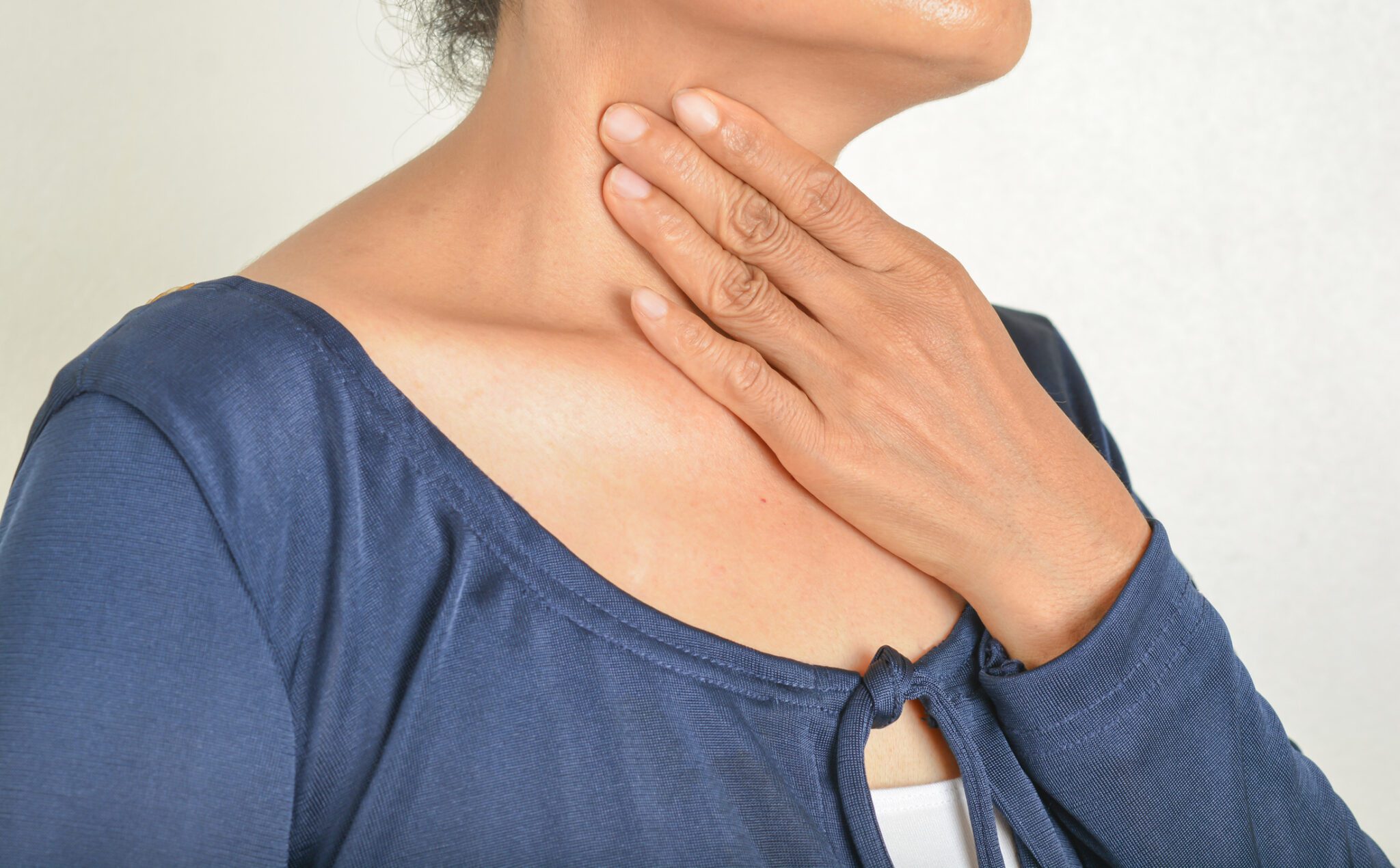 touching neck to feel head and neck cancer in lymph nodes